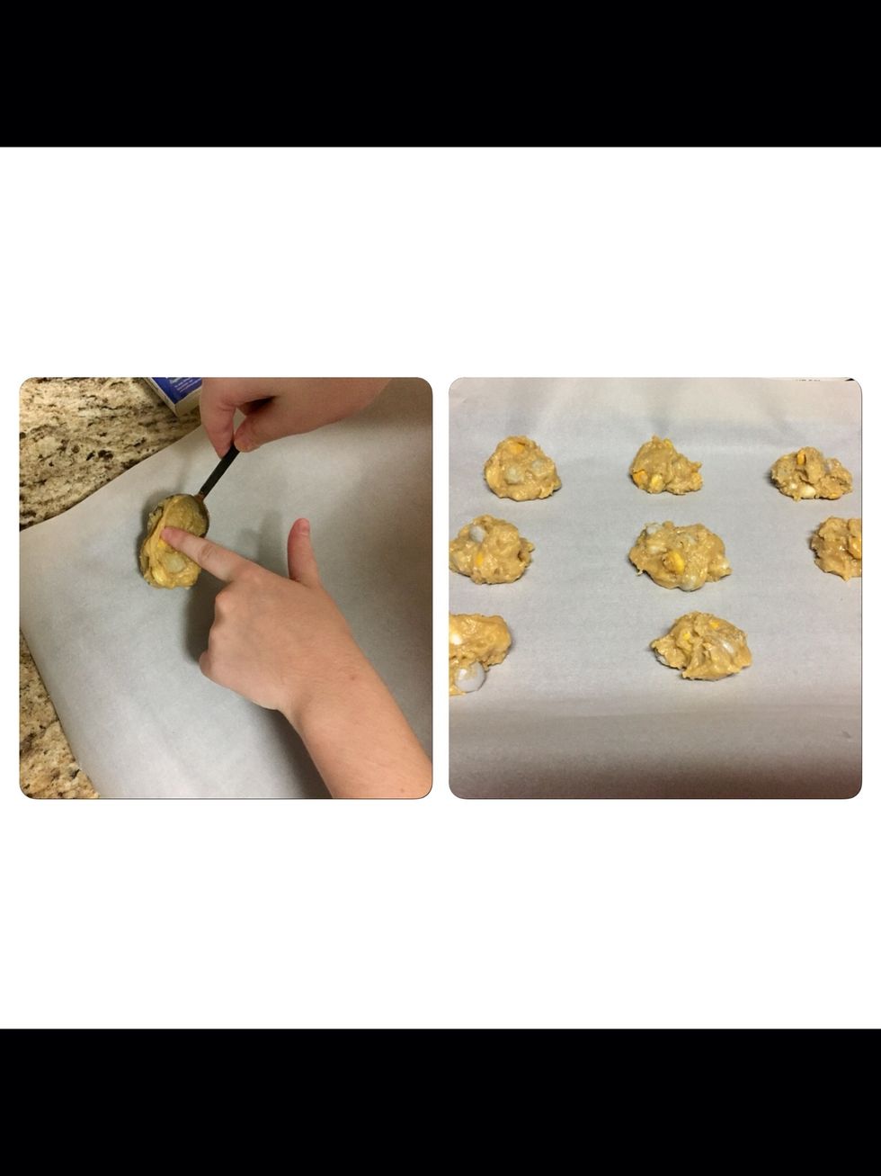 Using a spoon, scoop out 1 inch balls and place on the paper. Place each ball of dough 1 inch apart