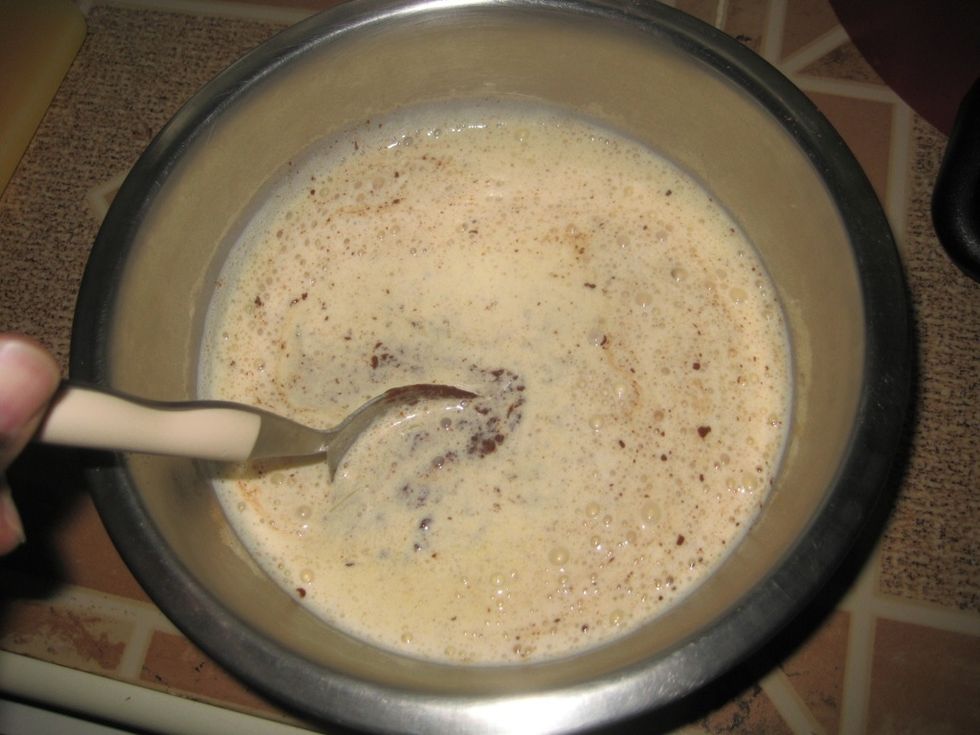Using a spoon start to slowly stir the chocolate.