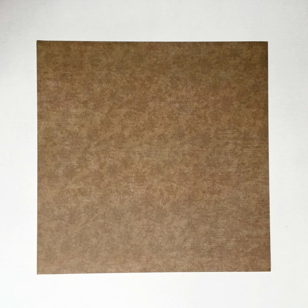 Using a square double-sided pattern paper, start with the side you want the message to be hidden inside...