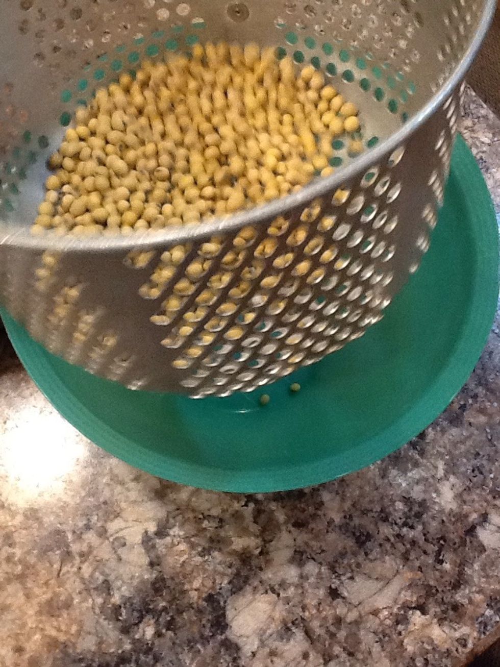 Using a strainer strain all the small beans and foreign matter into a separate bowl and discard.