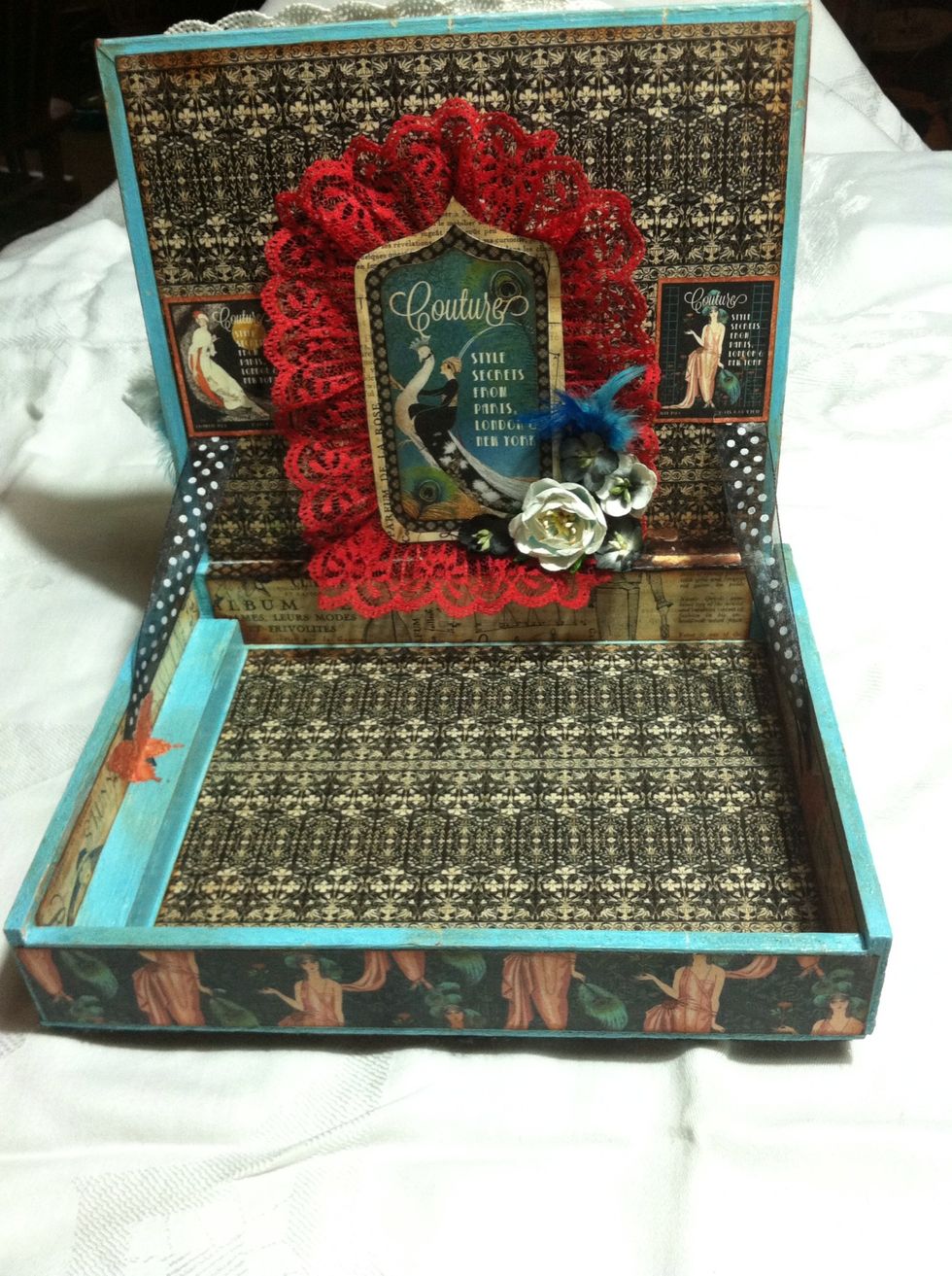 Using a tag from Tags and Pockets, I first cut mats to match the shape, added red lace and flowers and adhered to inside cover.