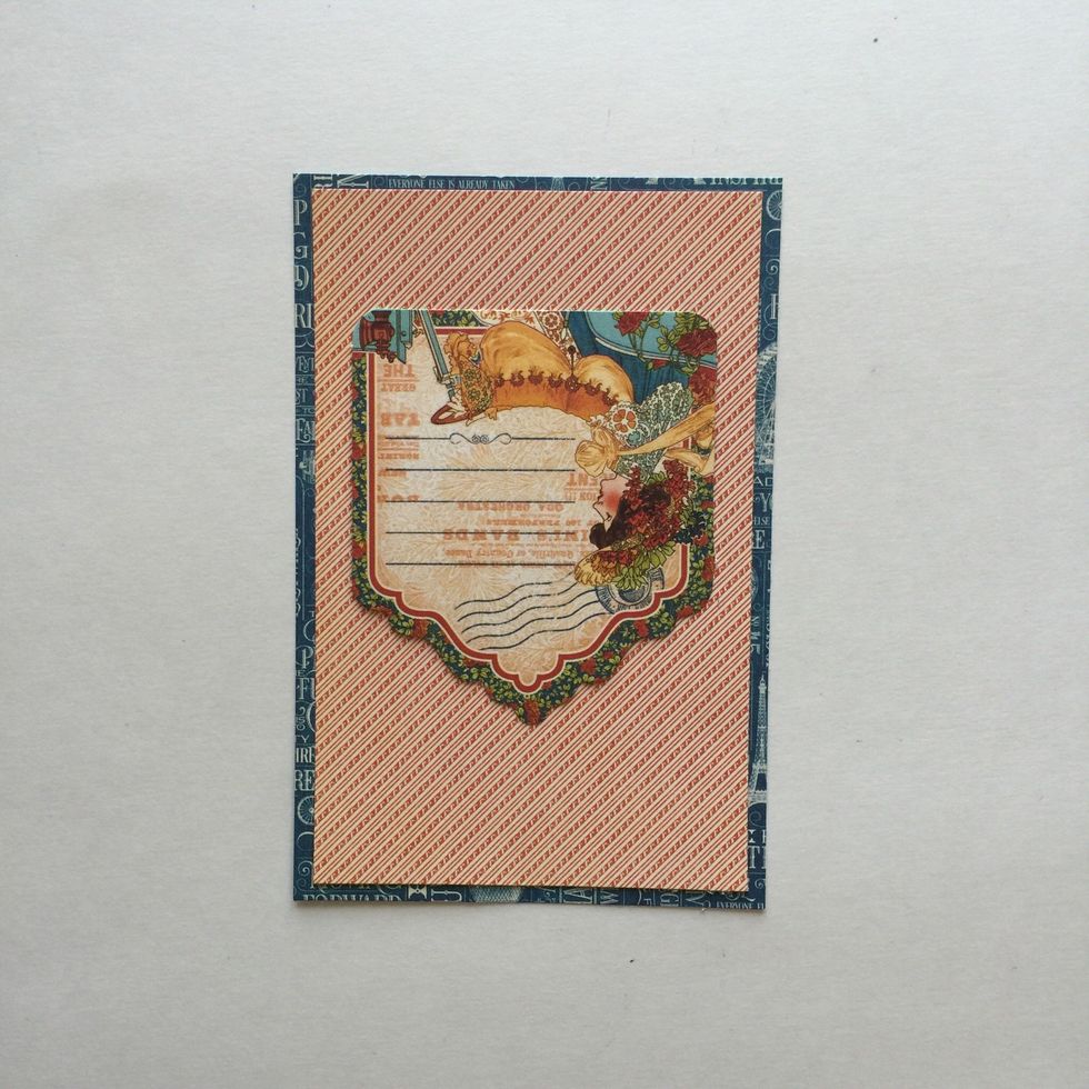 Using a tag from the Tags and Pockets, glue it upside down towards the top center of the card.