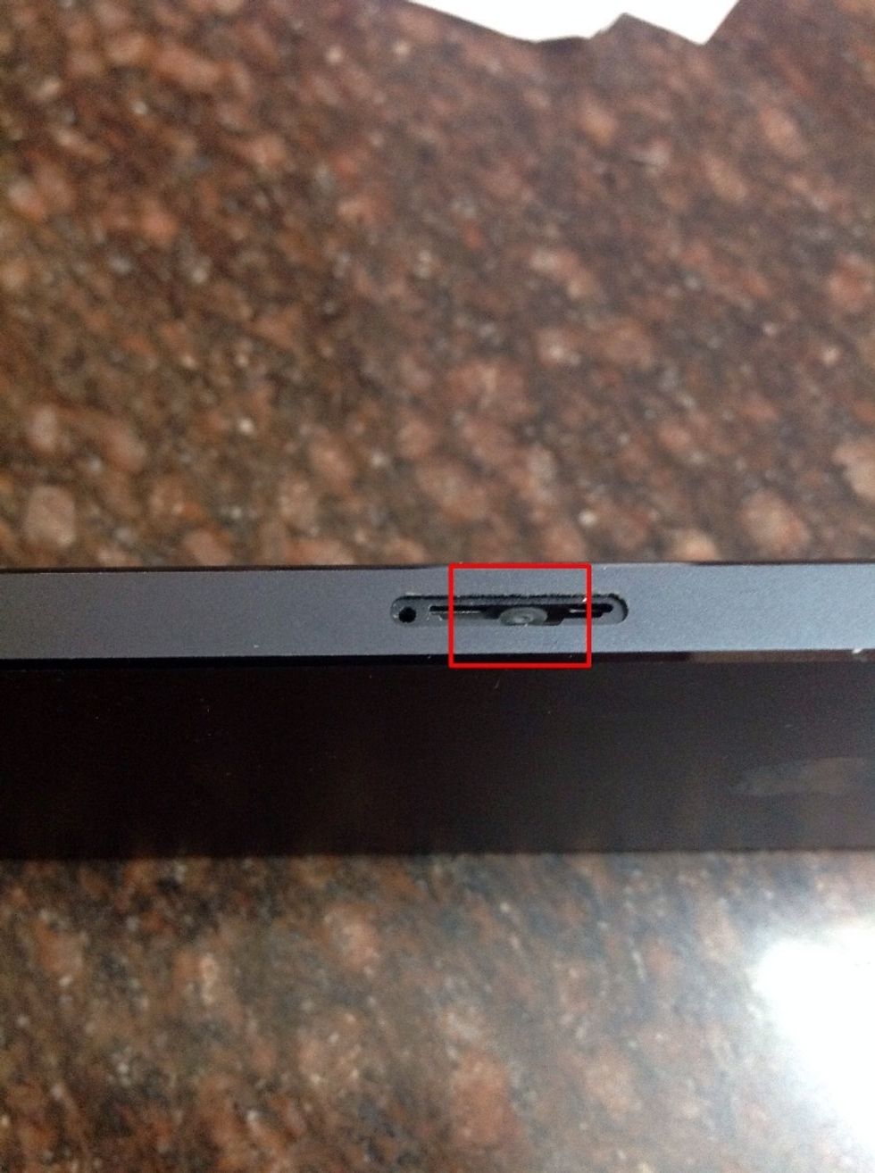 Using a torchlight look into the SIM-slot. You will c a small circle. If it is white then be assured, your iPhone is not under water damage. But if it is red in color then your iPhone has water damage