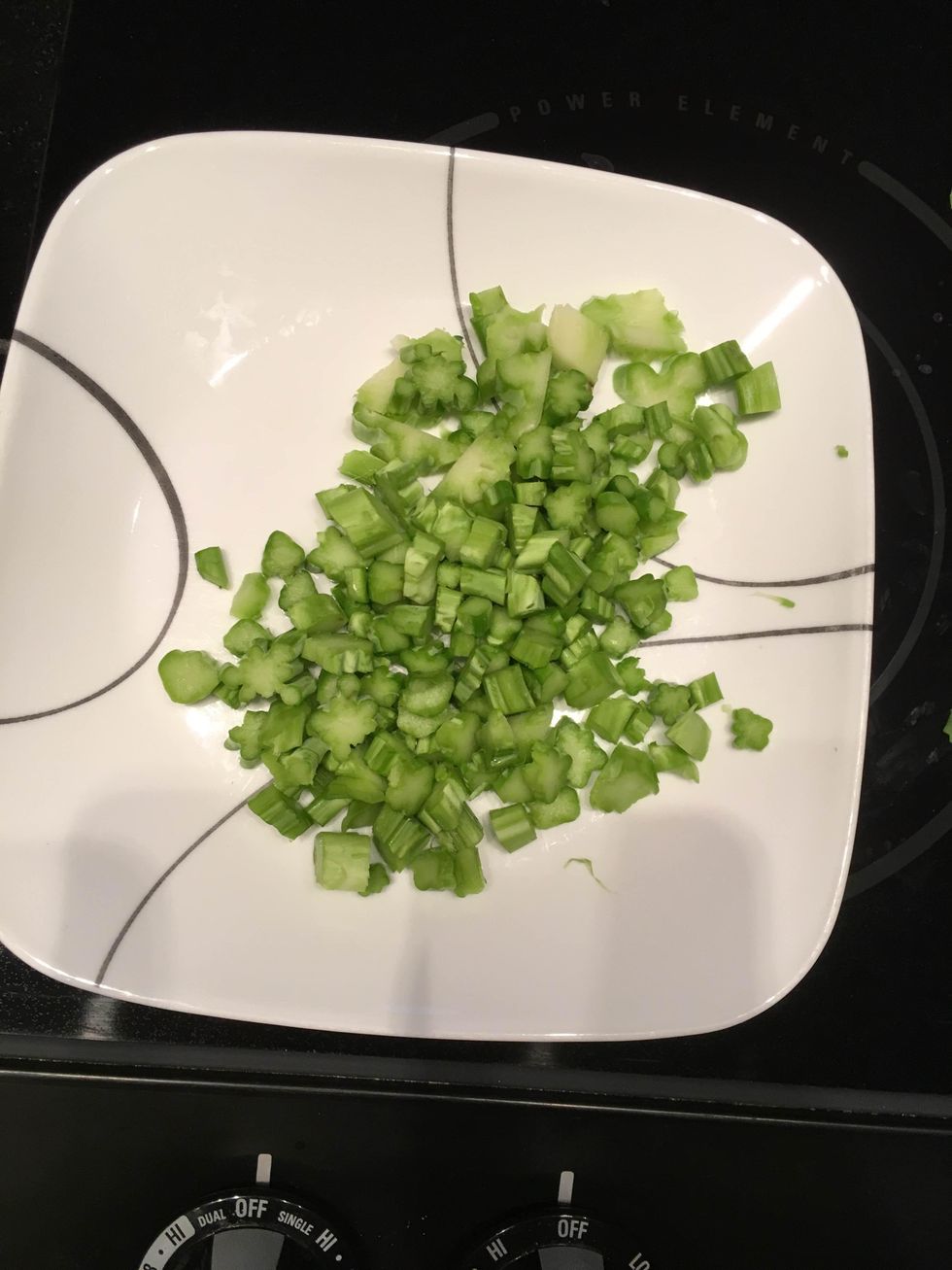 Using a vegetable peeler, remove the outer skin of the broccoli stems, and chop remaining stems into small pieces.