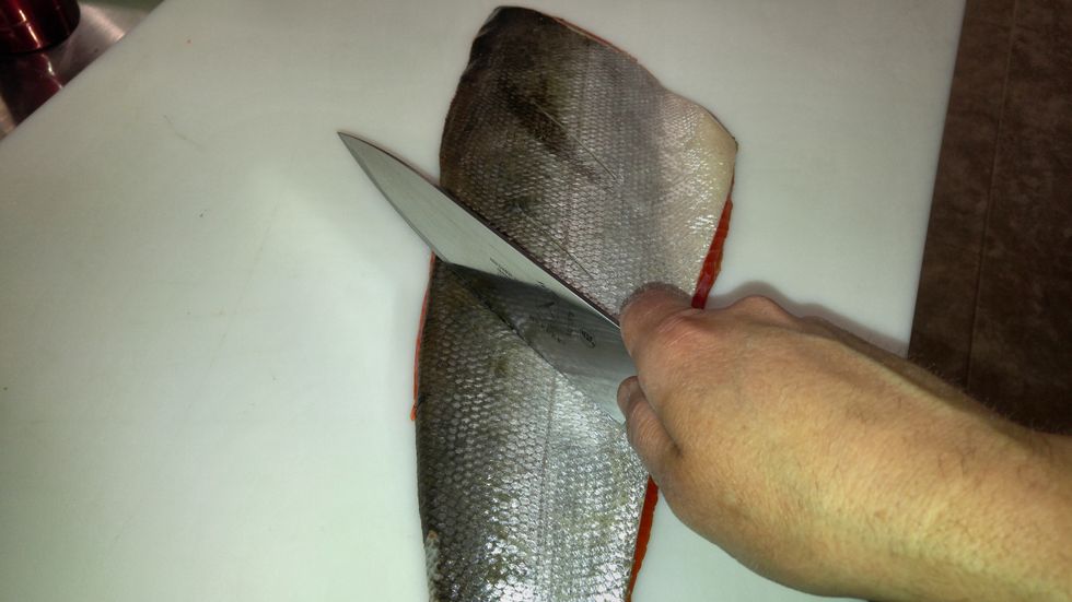 using a very sharp knife, make about 5 slices across the skin, just deep enough to cut through the skin and just into the meat.