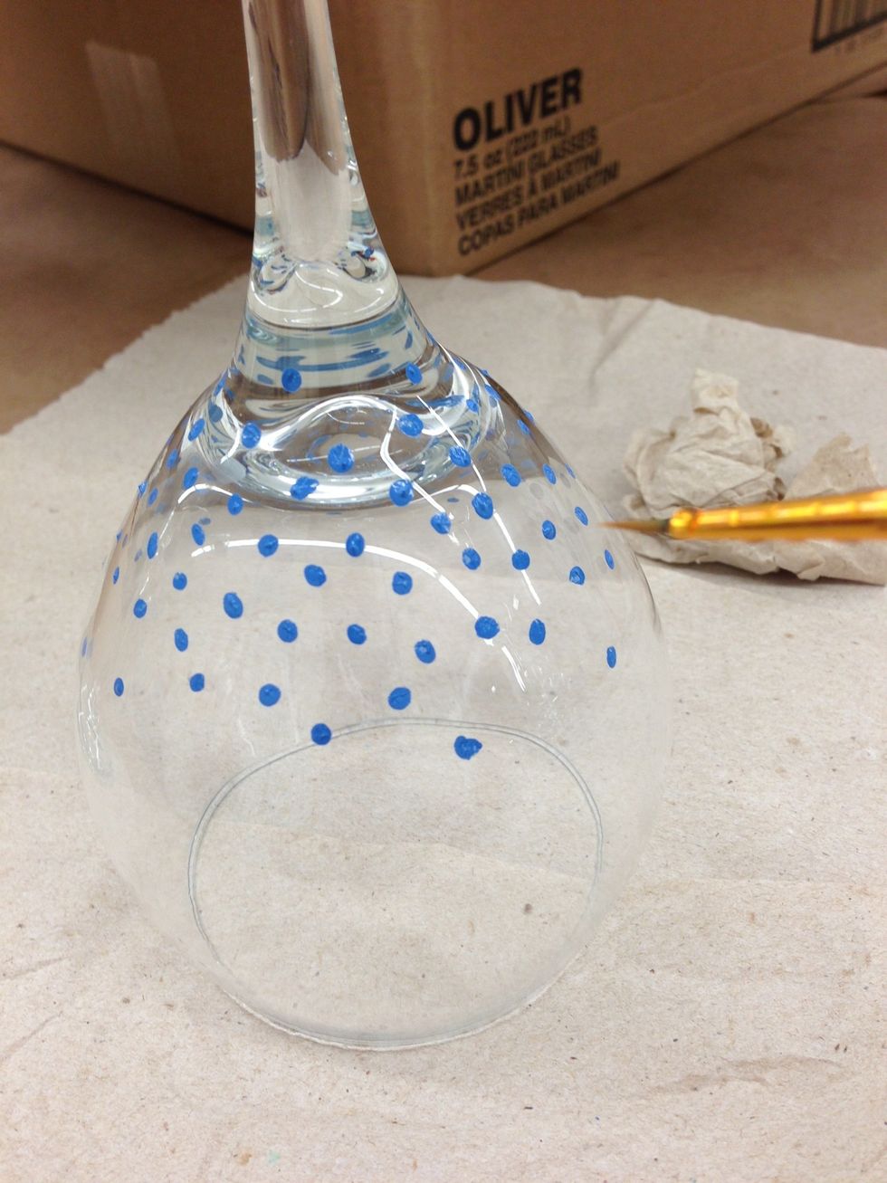 Using a very small paint brush, paint small dots sporadically. More concentrated at the top
