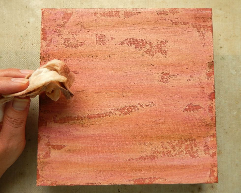 Using a wet wipe gently blend the Distress Crayon colours over the canvas to create a softer look, taking care not to remove too much colour - if you do add more and repeat the process.