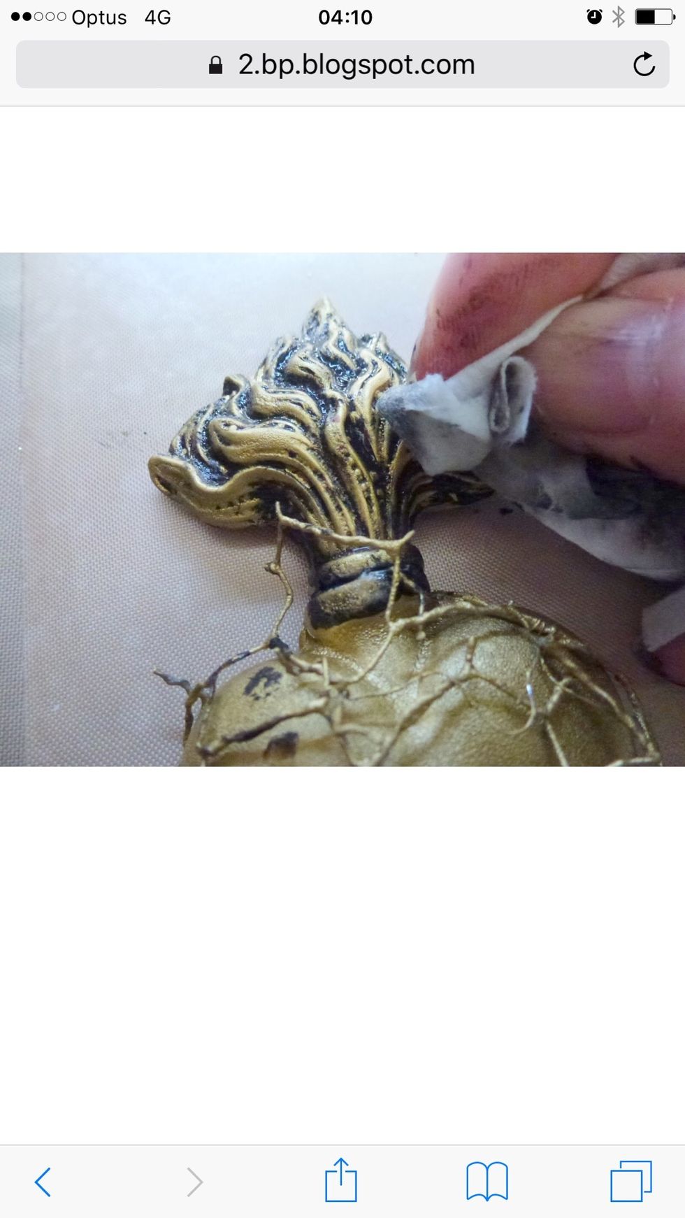 Using a wet wipe rub off/back some of the black gesso (as shown in photo) to highlight flame relief pattern.