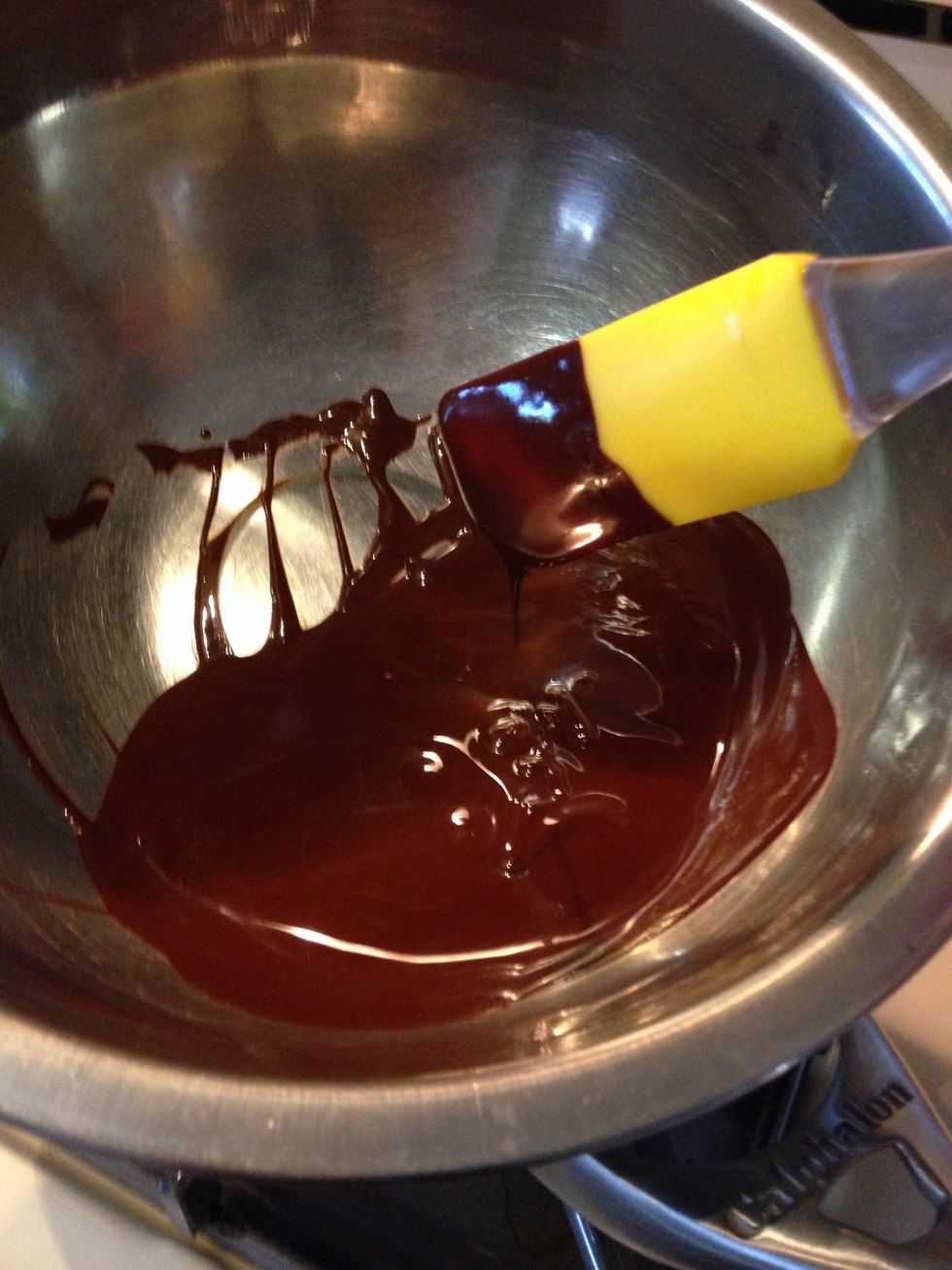 Using a whisk or a spatula, stir the chocolate until it melts completely.