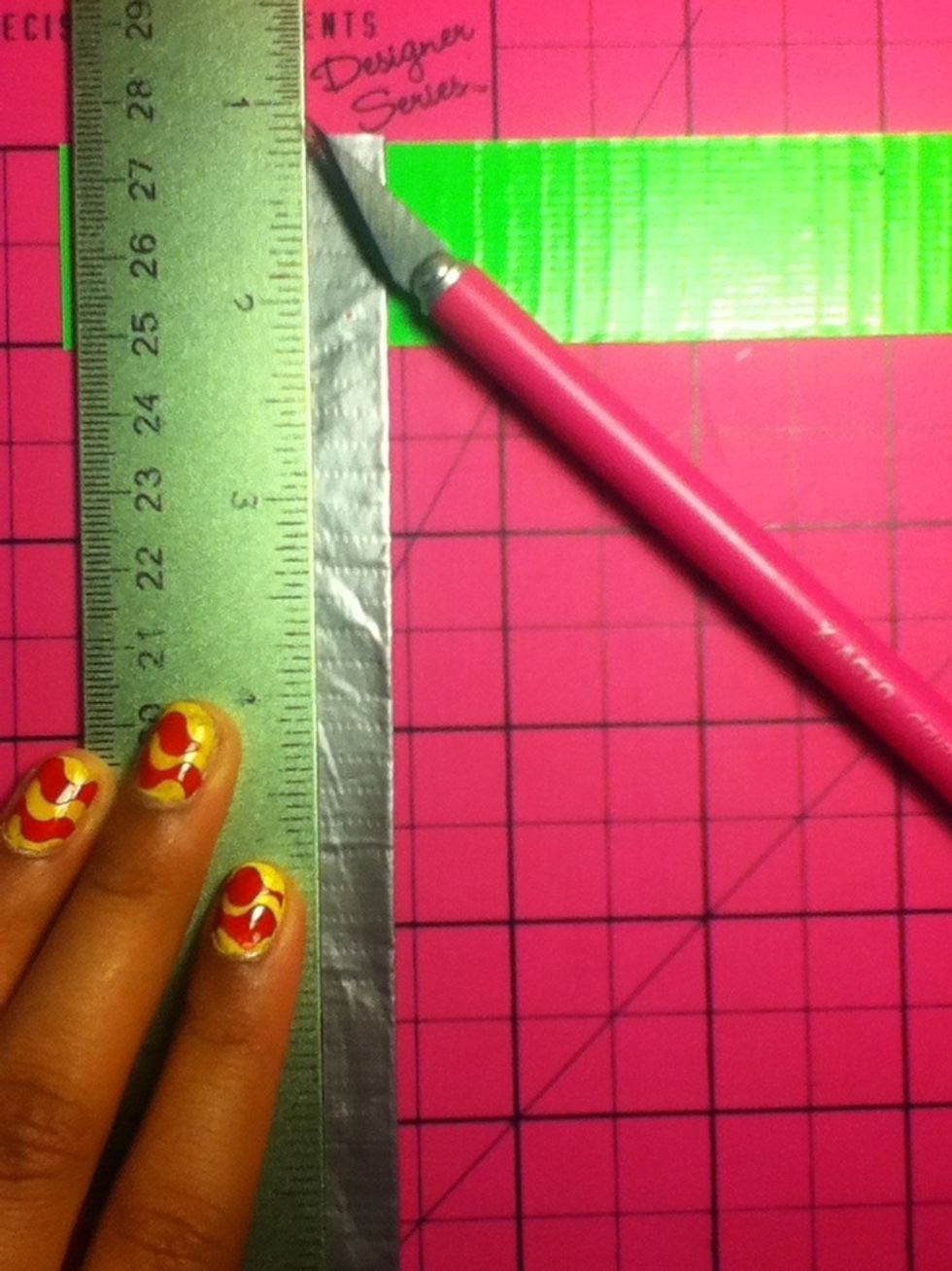 Using a X acto Knife, pass it through gently enough to indent, then I use scissors and cut it.. That way my xacto wont have to get dull fast