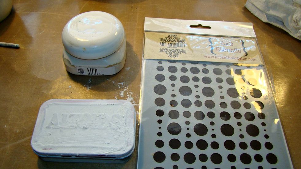 Using AA's Mud Paste and Bubbles stencil I started applying some texture to the tin.