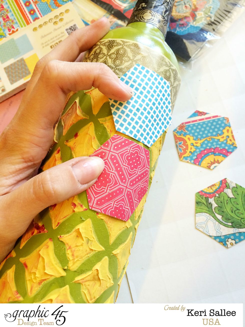 Using Aleene's Tacky Glue, arrange shapes to form your background. Because of the rough texture, hold the shapes for a few minutes to allow the glue to grab. A diagonal arrangement works best.