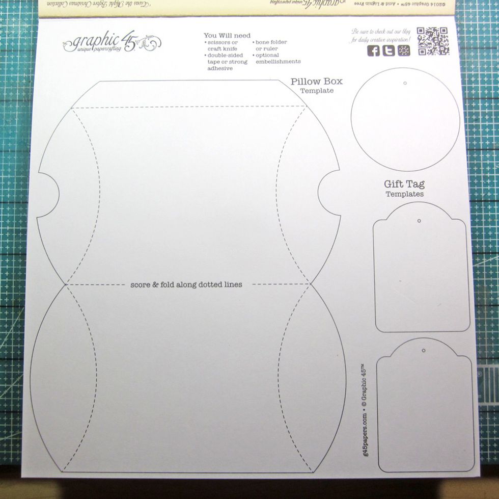 Using an 8 x 8 Graphic 45 paper pad, cut out the pillow box template found on the back cover. I'm using the Twas the Night Before Christmas Collection for this tutorial.
