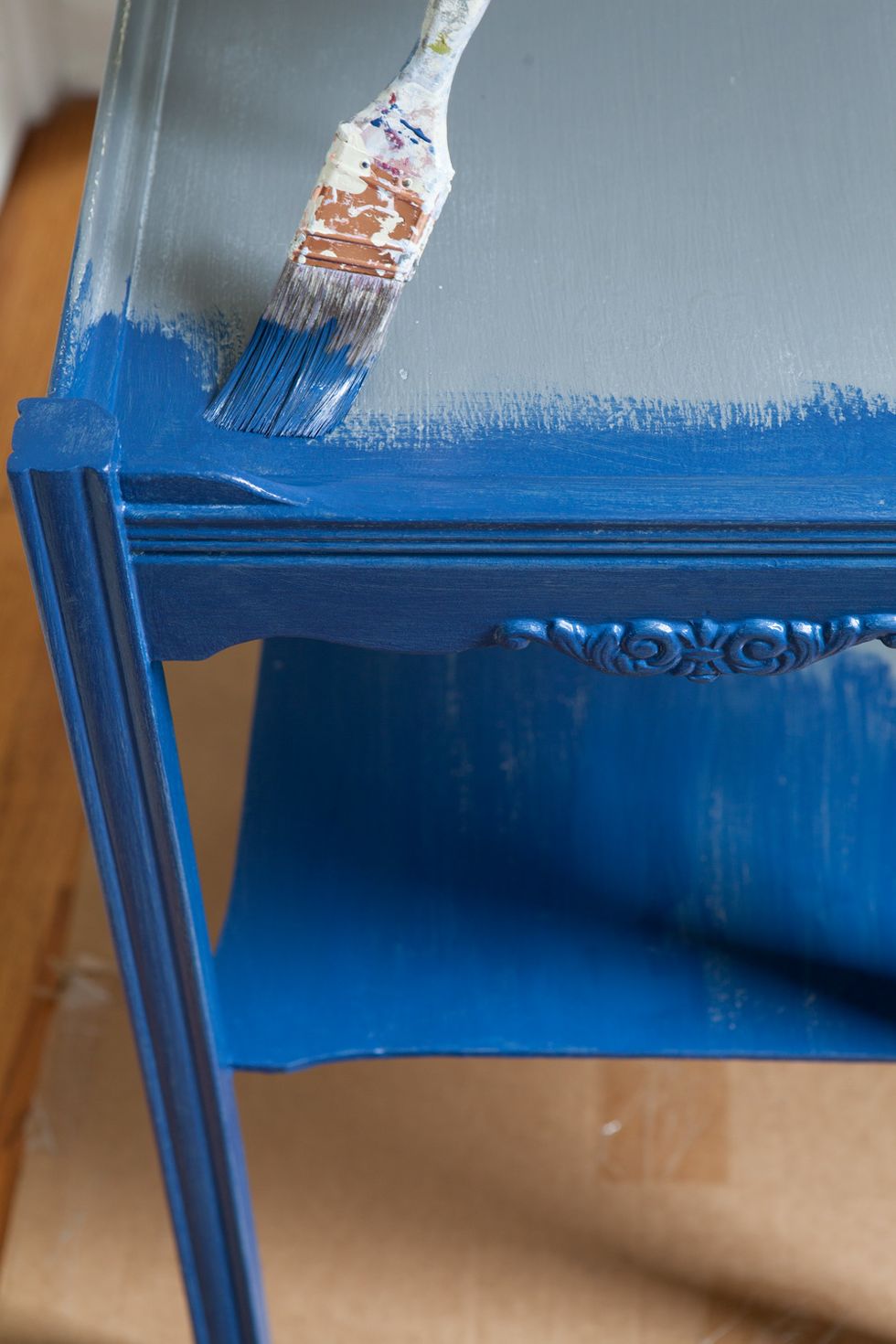 Using an angled brush, paint table in Rich Navy.  Apply 2 light coats, letting the first one dry before applying the second. Once dry, check to make sure  color is even, apply third coat if needed.