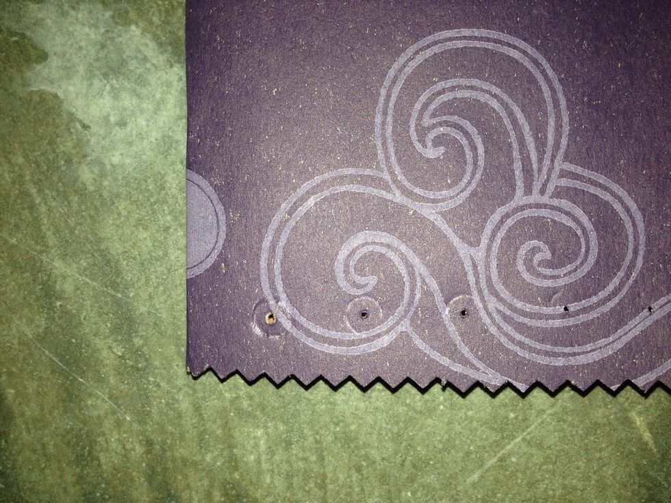 Using an awl, seam ripper or other sharp object, make 10 holes along each non-folded side of the pouch.