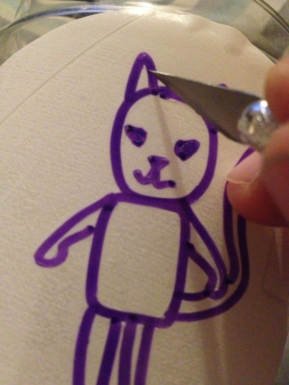 Using an exacto knife, cut away the areas you would like etched.