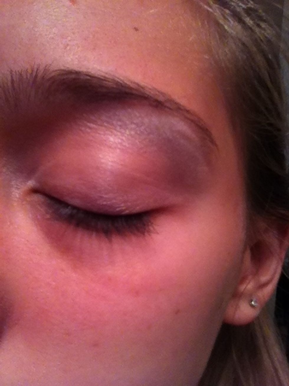 Using an eyeshadow brush apply white eyeshadow right under your brow bone, the inner corner of your eye, and a slight bit on the very top of the eye lid.