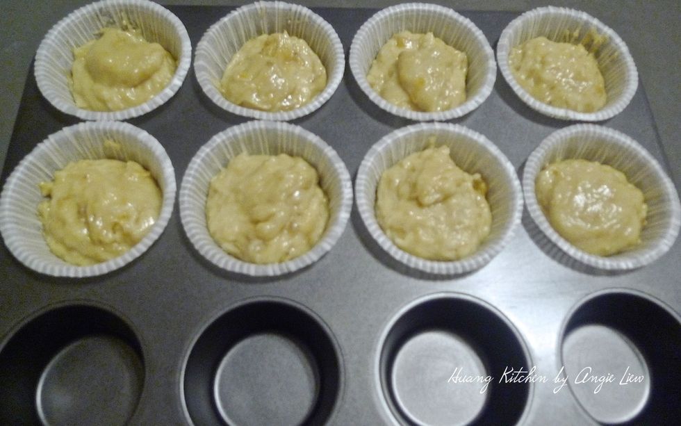 Using an ice-cream scoop, spoon batter into the muffin cups till 2/3 full.