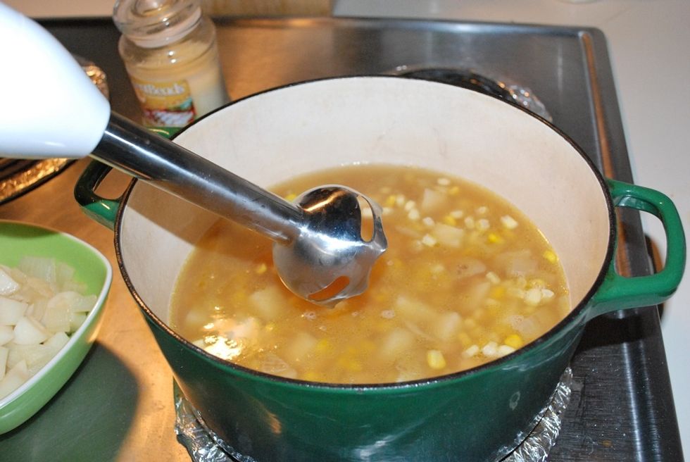 Using an immersion blender, blend the ingredients in the pot until they are a smooth consistency