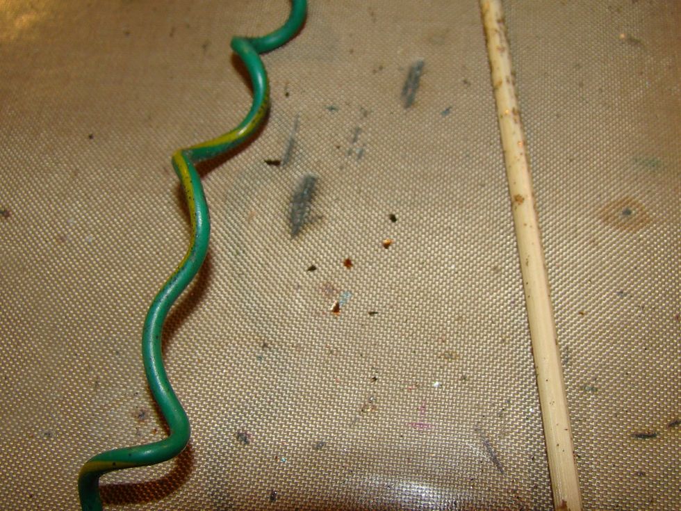 Using an old piece of wire, wrap it around a skewer to create your stem for your steampunk flower.