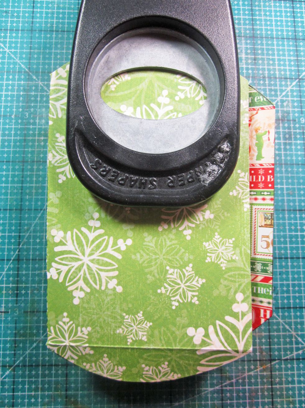 Using an oval punch, fold the bag over flat and punch. This makes a handle hole.