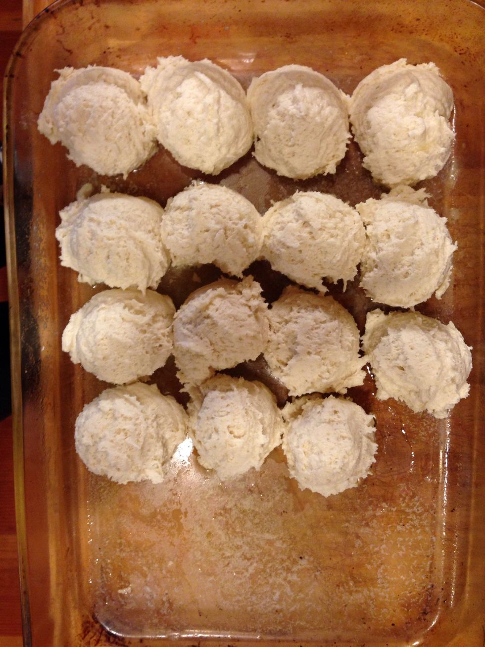 Using and ice cream scoop place dough into buttered pan :)