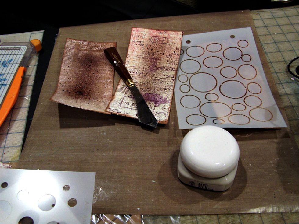 Using Art Anthology Mud and Orbital Stencil add texture to each tag. Allow to dry.