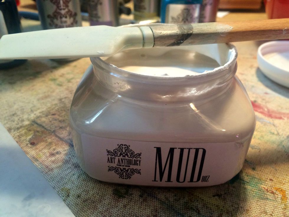 Using Art Anthology Mud and the catalyst spatula I created some texture and additional pattern in the background. Before I did this I sealed the canvas with a fixatiff so the colors would stay true.