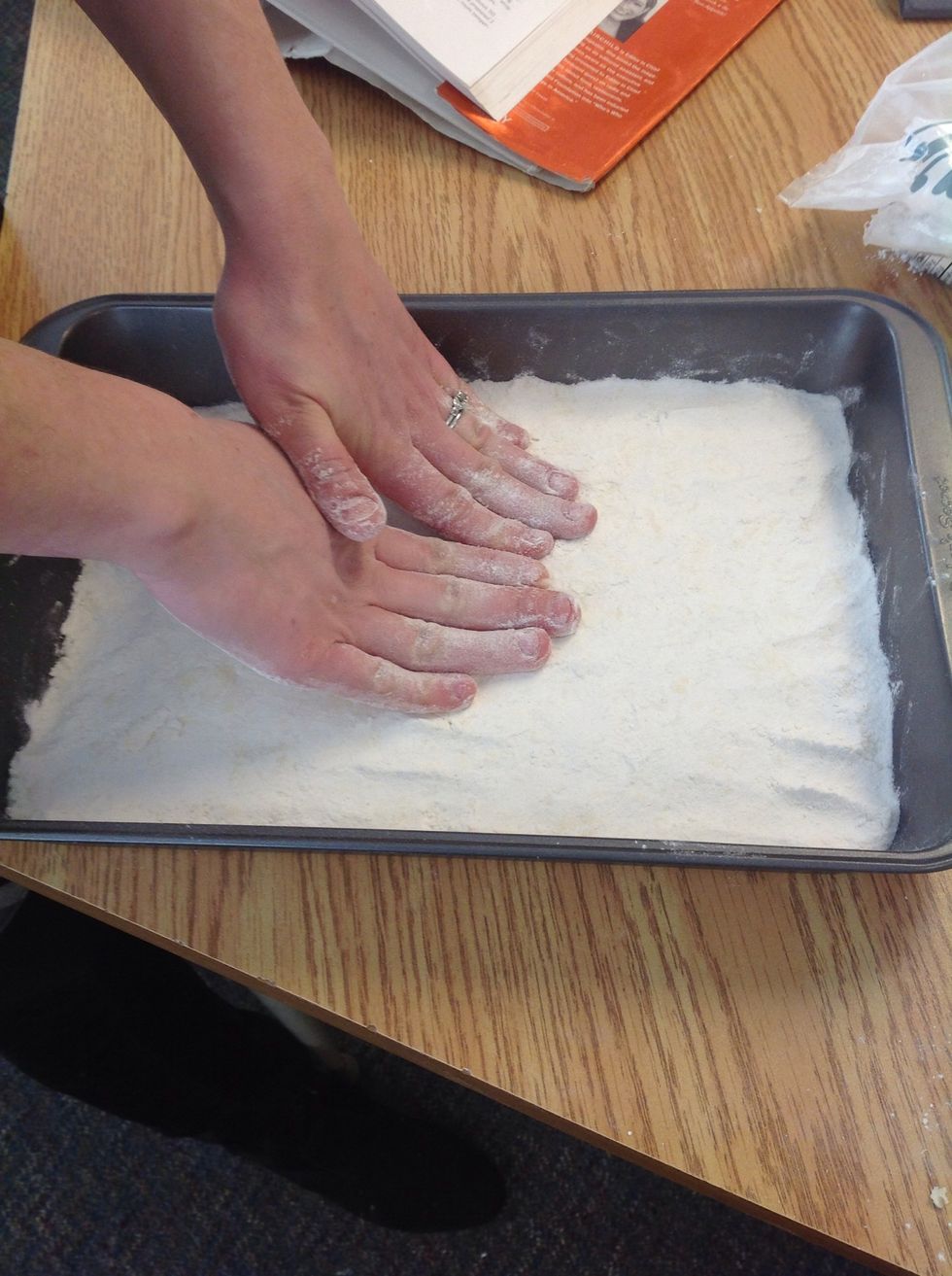 Using back of a fork or hands push down dough into bottom of baking pan with high sides