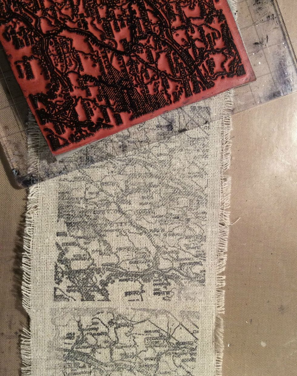 Using Black Stazon I stamped my image on 2" wide piece of muslin and then ripped it in long strips to tie to the binding of my album.