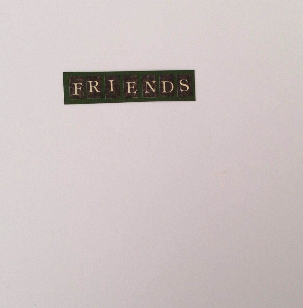 Using coordinating card stock alphabet stickers spell the word friends, mount on green card stock and trim creating a small border.