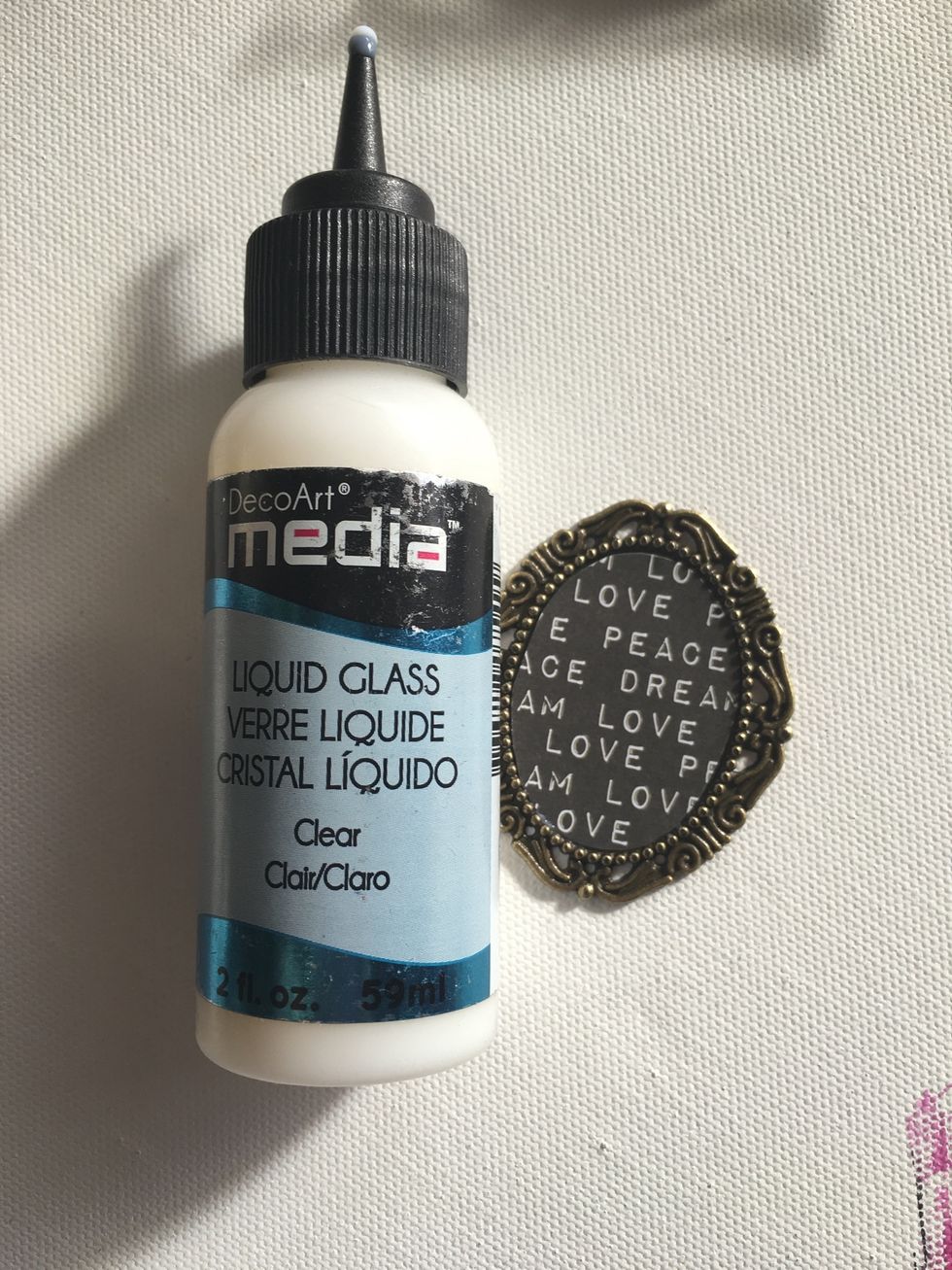 Using DecoArt Liquid Glass, secure your paper inside your frame and then add a healthy coat on top. Don't worry...it goes on white but will dry crystal clear.