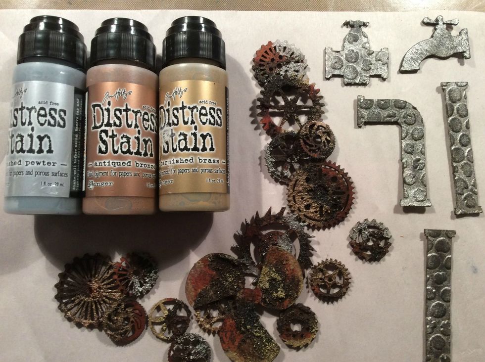 Using DI Stains I added touches of Antique Bronze, Tarnished Brass, & Brushed Pewter. And in the photo are my pipes with the black gesso dry brushed on.