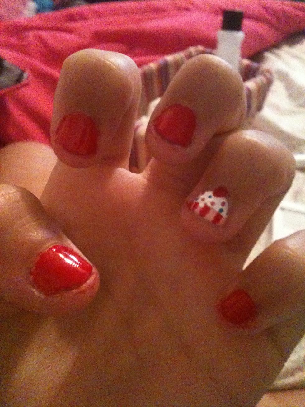 Using different colored polish paint small dots, sprinkles