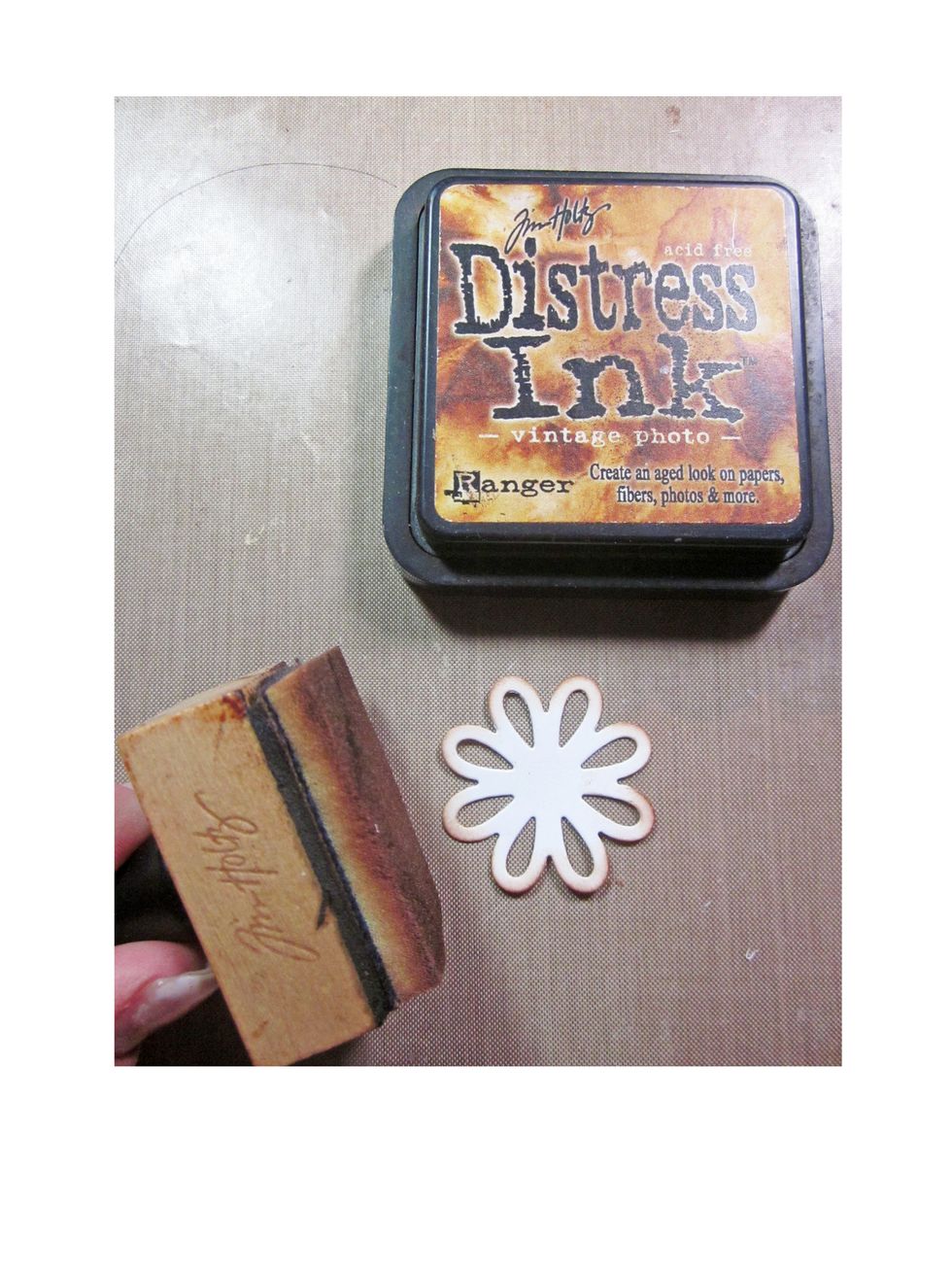 Using Distress Ink/ Vintage Photo ink the edges of the top petals.