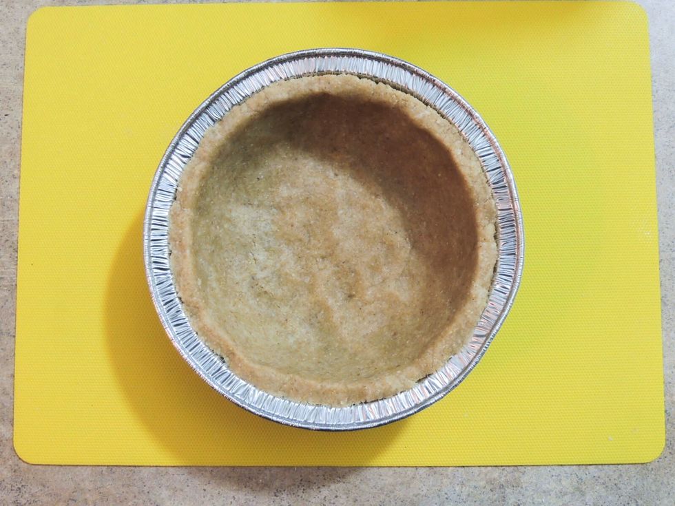 Using fingers mold the crust evenly inside of the pan like so. The healthy and tasty crust is ready, now onto the delicious protein filling.