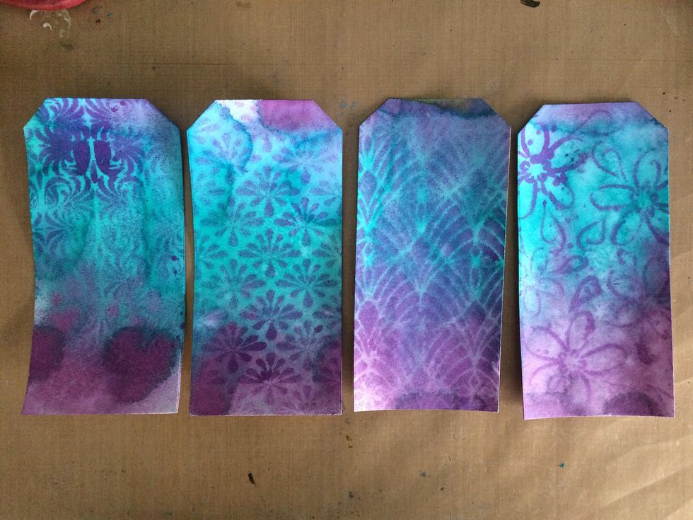 Using four different stencils and Plush colorations, I added more interest to the backgrounds of my tags.