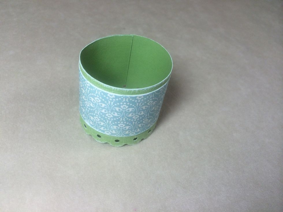 Using glue stick, adhere the papers together then roll so that the ends overlap about an inch. Use Scor-Tape to secure.