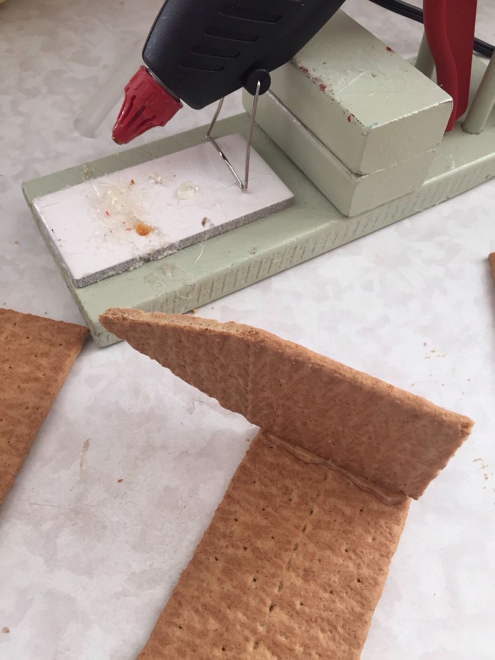 Using hot glue, carefully glue pieces together...
