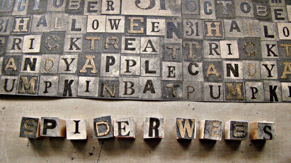 Using Ideaology Paper Stash Halloween Haunts I cut out the letters that spell spider webs. I glued the letter on wooden blocks purchased at the craft store and distressed with black soot ink.