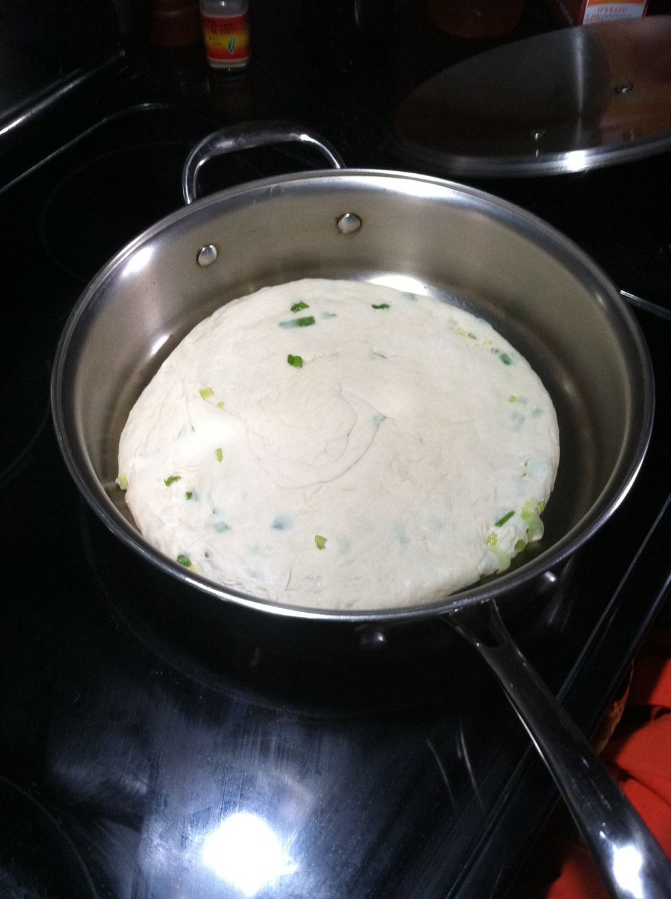 Using low heat, pre-heat a flat heavy bottomed pan, cast iron is ok. Vegetable oil is not needed for this step. Once the pan is hot, gently place the pancake sesame side down. Cover the pan.