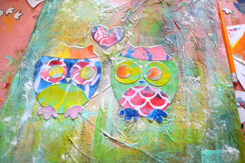 Using Matte Gel medium, glue down your owls and the heart. Make sure you put them on the correct sides so they are looking at each other.