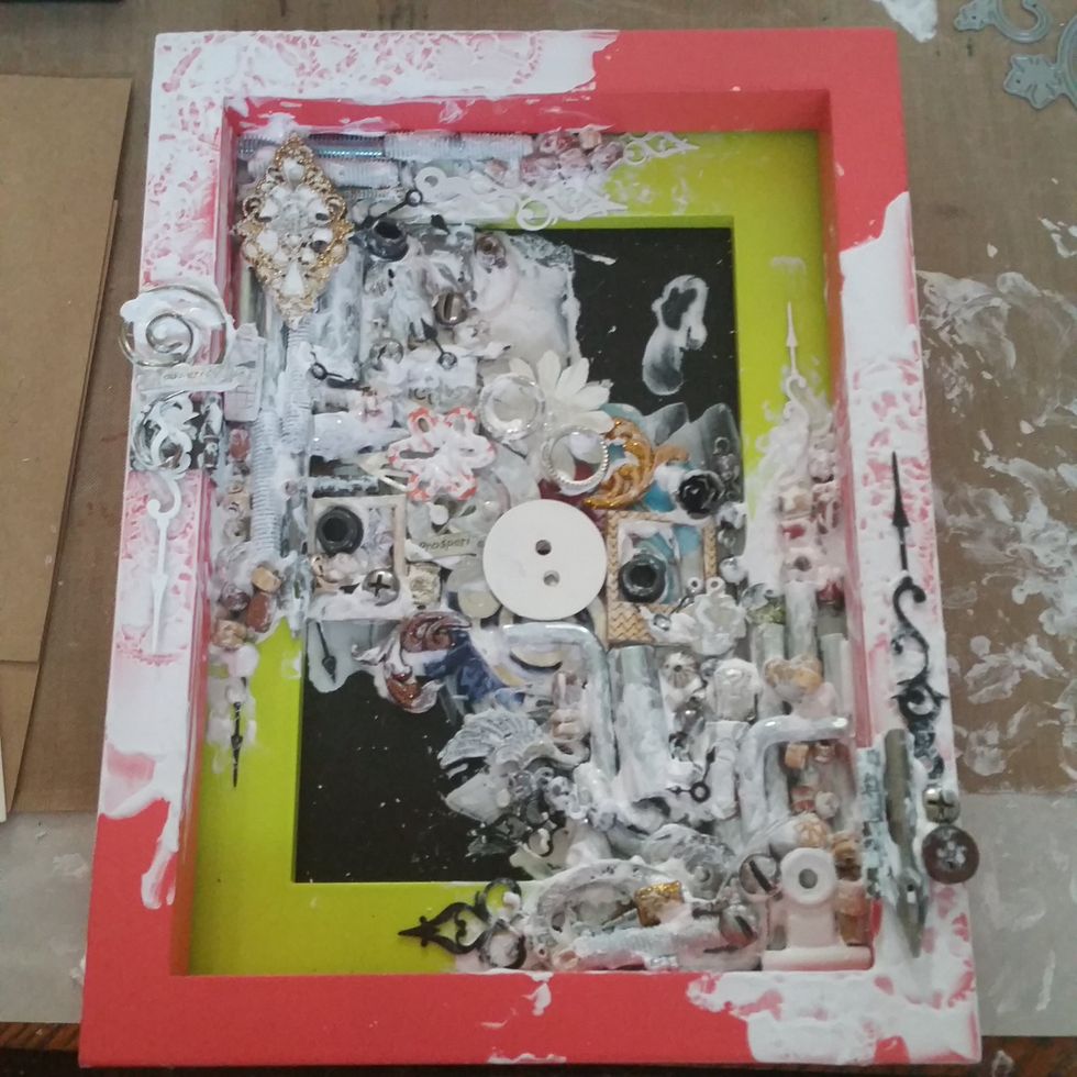 Using molding paste as the "glue" I layered lots of bits and bobs I have collected from hardware, buttons, beads, metals, wood, flowers, charms, etc. Let it dry completely.