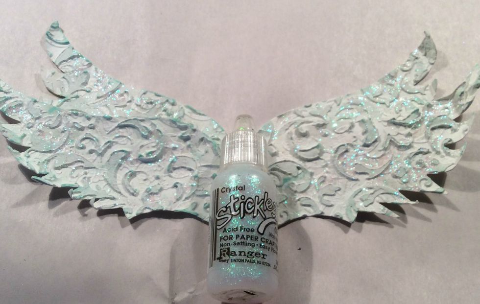 Using my diecut machine I then cut two sets of wings so they could be layered then gave them a nice coat of Crystal Stickles.