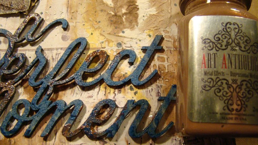 Using my finger I rubbed Metal Effects - Copper here and there over my title for a aged rusty look.