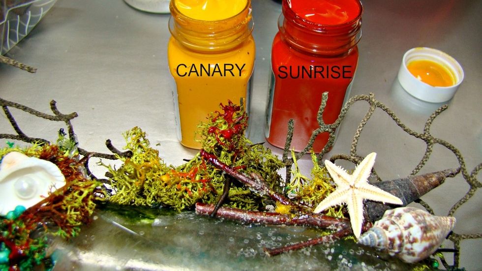 Using my finger I smudged Shine in Canary and Sunrise here and there are wood pieces and also moss that I glued around the bottle.
