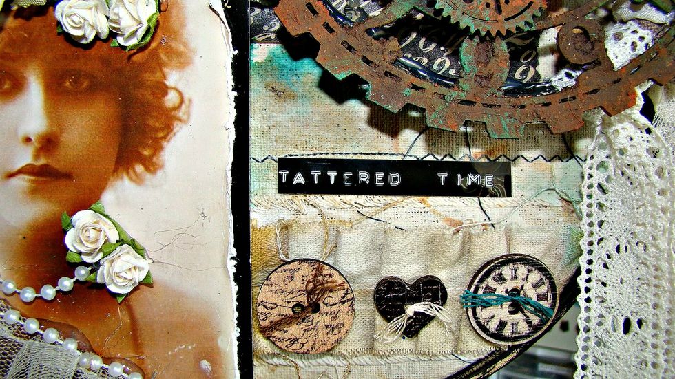 Using my label maker I made my title and added some old wooden buttons with coordinating threads.
