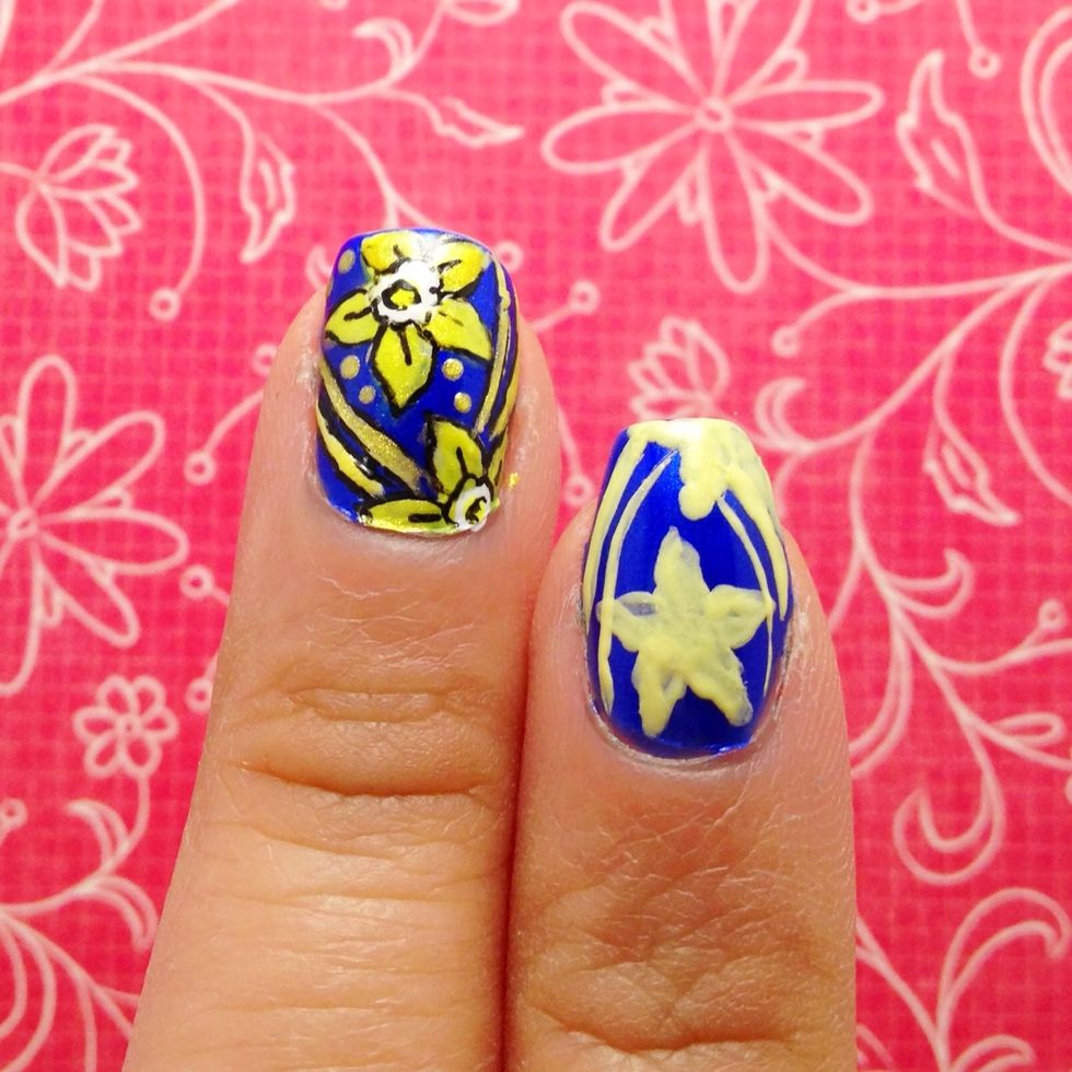 Using nail art brush and pale yellow polish, create the body of the design.
