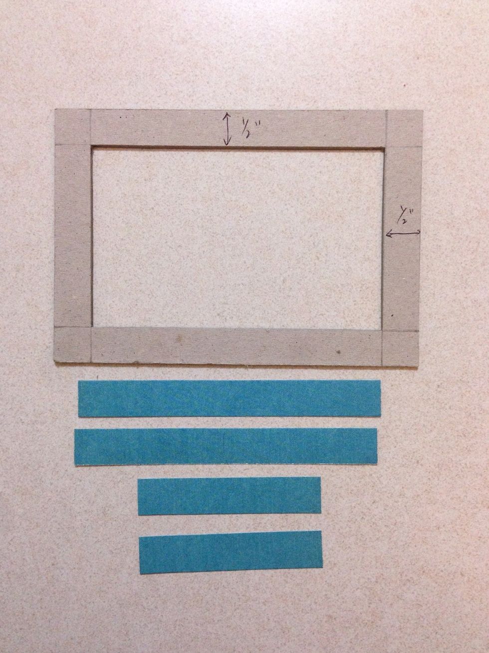 Using one blue sheet of paper from the 6" x 6" Solids & Patterns paper pad, trim strips of 0.5" thick by lengths of 4" and 2.5"... You will need 2 of each...