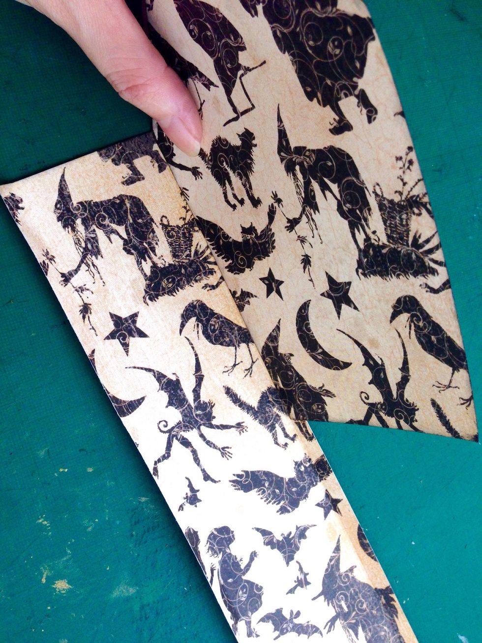 Using one of the tomb cut out or template, place along the side onto the strip... Make a marking using a pencil...